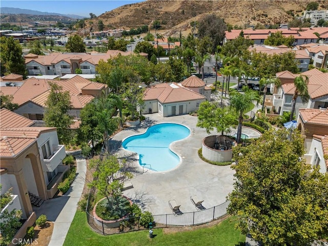 birds eye view of property featuring a mountain view