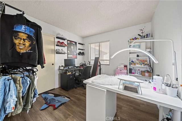 office with a textured ceiling and dark hardwood / wood-style floors