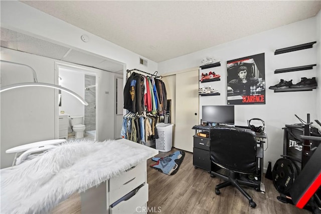 home office featuring hardwood / wood-style floors