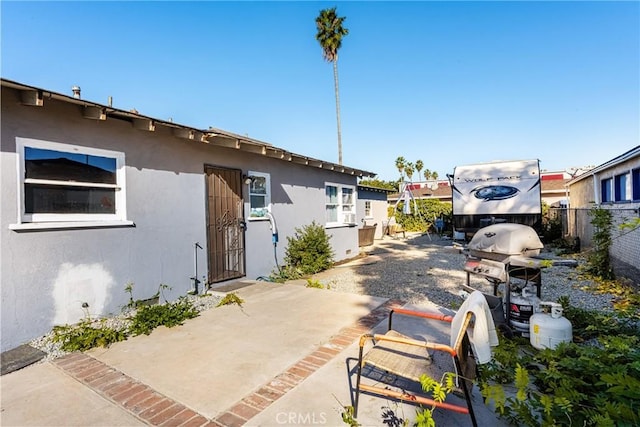 rear view of property featuring a patio