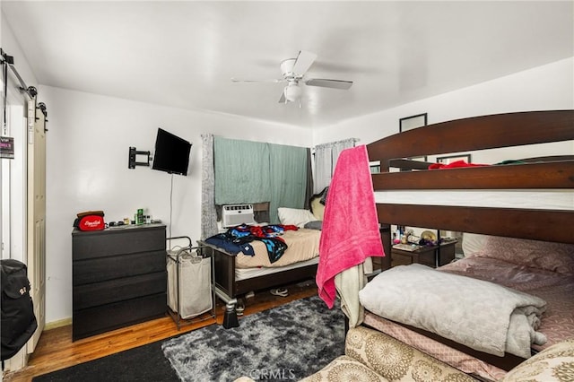 bedroom featuring ceiling fan and hardwood / wood-style flooring