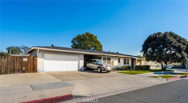 ranch-style house featuring a garage