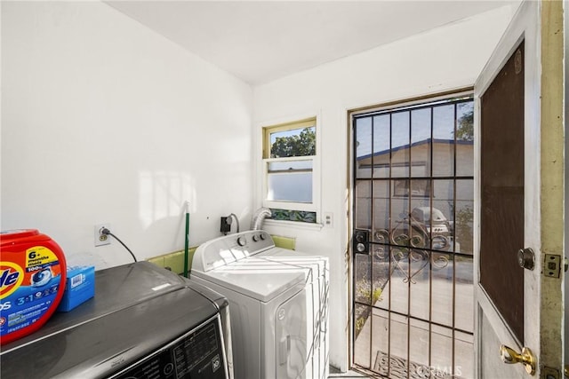 laundry room featuring washing machine and clothes dryer