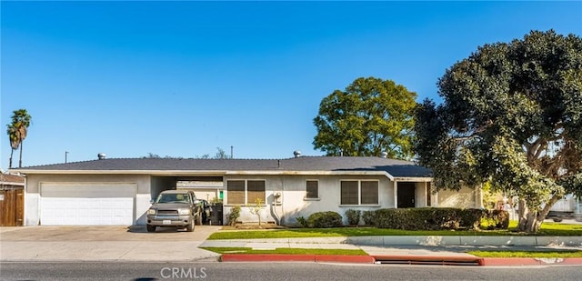 ranch-style house featuring a garage