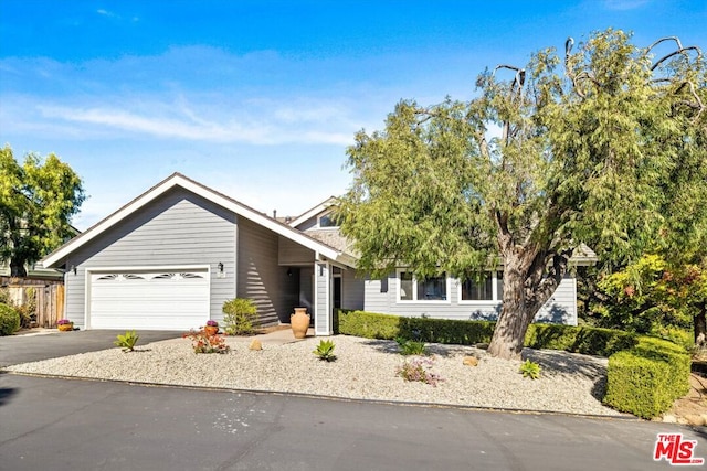 view of front of property with a garage