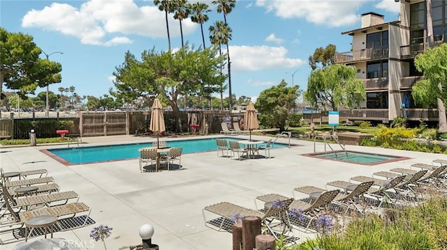 view of swimming pool with a patio