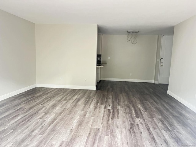 unfurnished room featuring dark hardwood / wood-style floors