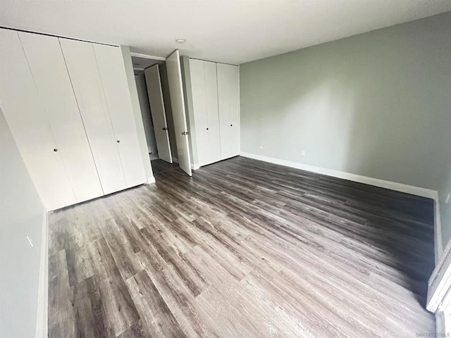 unfurnished bedroom with wood-type flooring