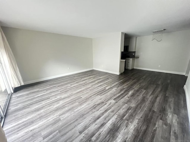 unfurnished living room featuring hardwood / wood-style floors