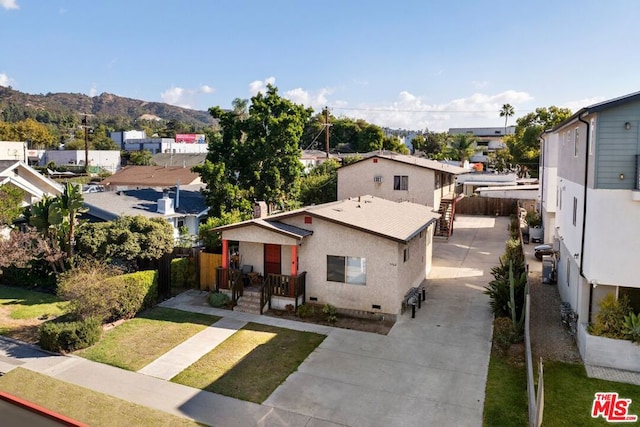 birds eye view of property with a mountain view