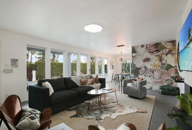 living room featuring a notable chandelier