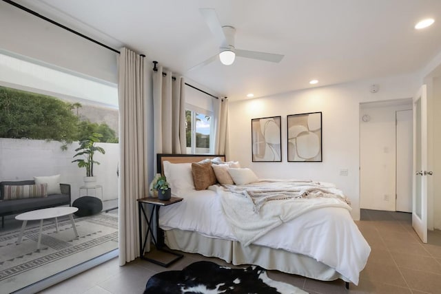 bedroom featuring ceiling fan, access to exterior, and light tile patterned floors