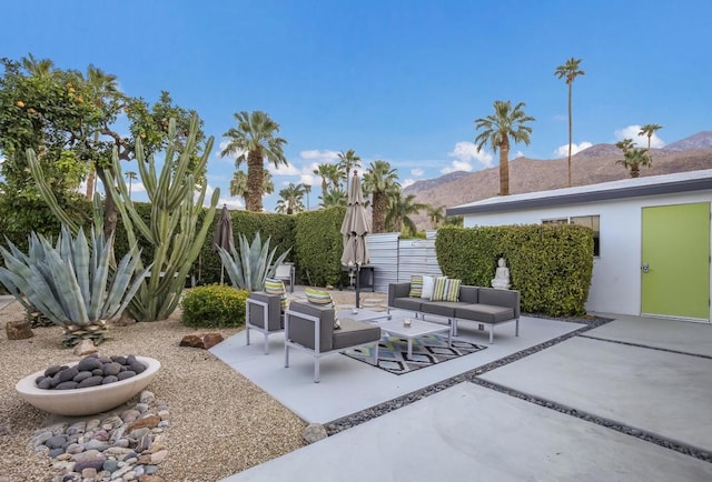 view of patio with a mountain view and an outdoor living space