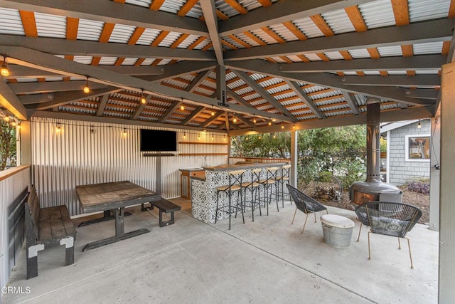 view of patio / terrace with a gazebo and an outdoor bar