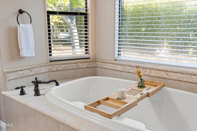 bathroom with tiled bath