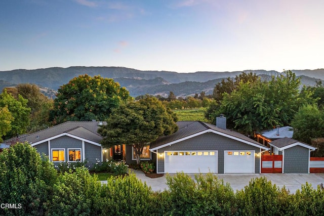 view of front of house featuring a mountain view and a garage