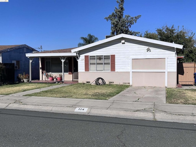 single story home featuring a front lawn and a garage