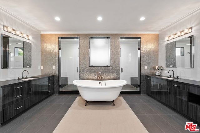 bathroom featuring tile patterned flooring, vanity, crown molding, and independent shower and bath