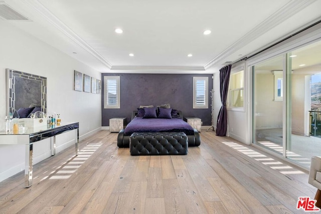 bedroom featuring multiple windows, light hardwood / wood-style floors, and ornamental molding