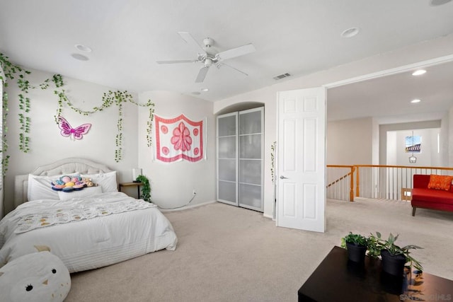 bedroom featuring ceiling fan and light carpet