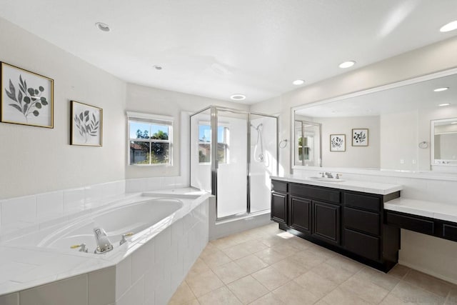 bathroom with vanity, tile patterned floors, and plus walk in shower