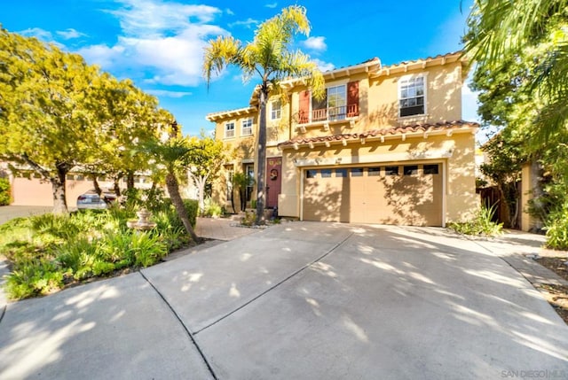 mediterranean / spanish house with a garage