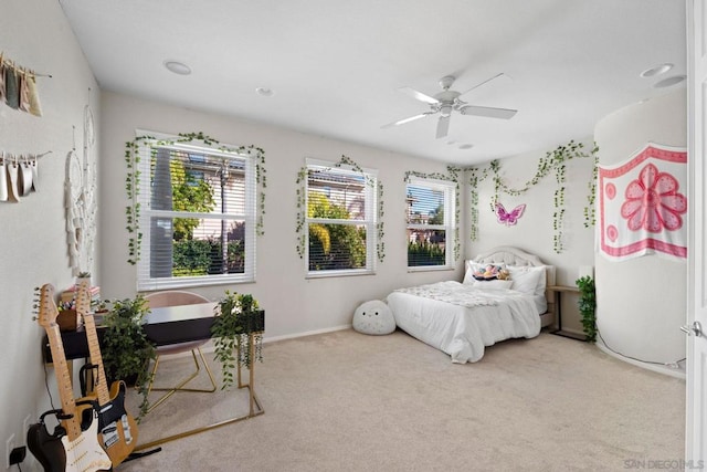 bedroom with ceiling fan and carpet floors