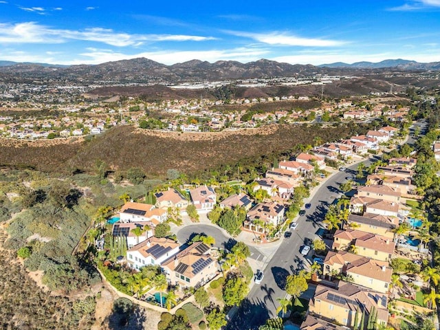 birds eye view of property featuring a mountain view