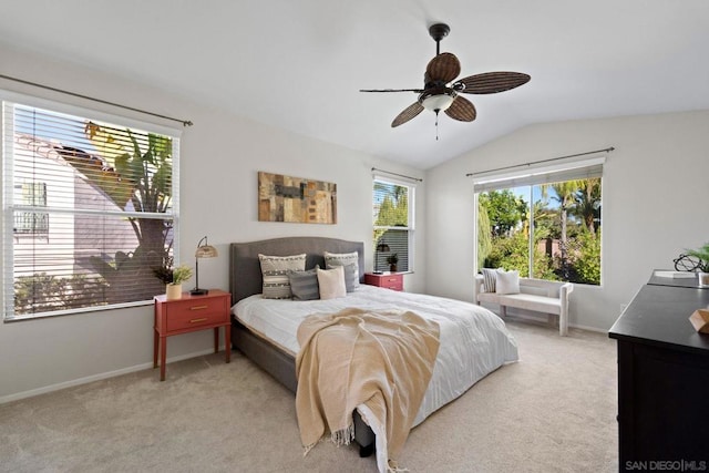 carpeted bedroom featuring ceiling fan and vaulted ceiling