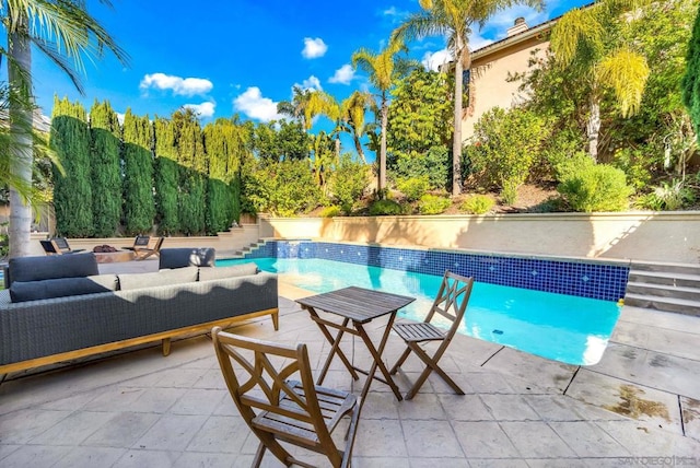 view of pool featuring a patio and outdoor lounge area