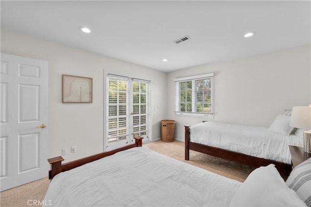 bedroom with light colored carpet