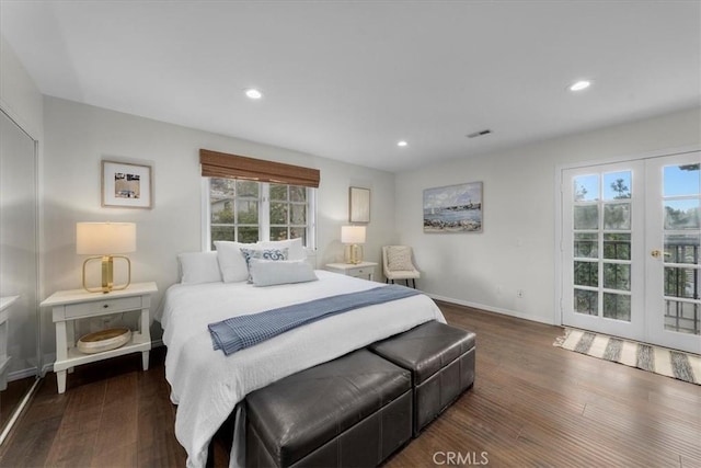 bedroom featuring dark wood-type flooring and french doors