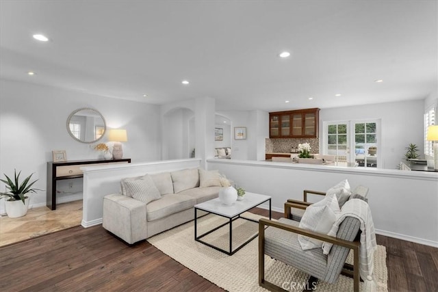 living room with dark hardwood / wood-style flooring