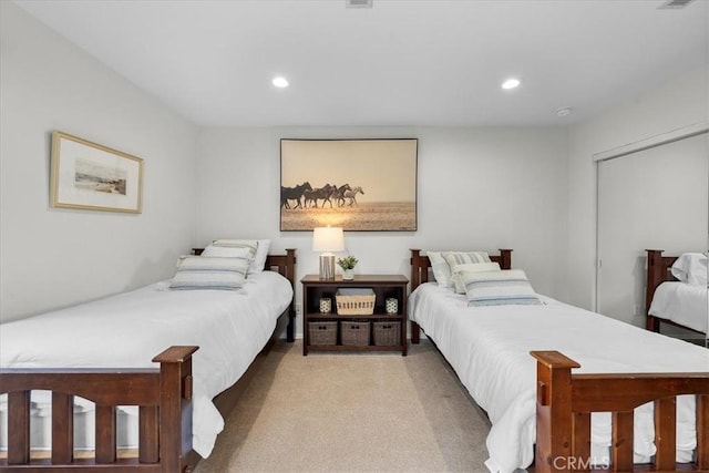 bedroom featuring light carpet