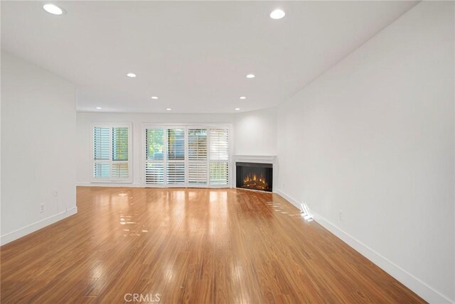 unfurnished living room with light hardwood / wood-style floors