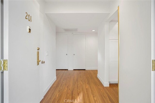 hallway featuring light hardwood / wood-style floors