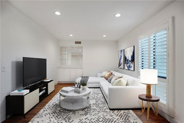 living room with dark hardwood / wood-style floors