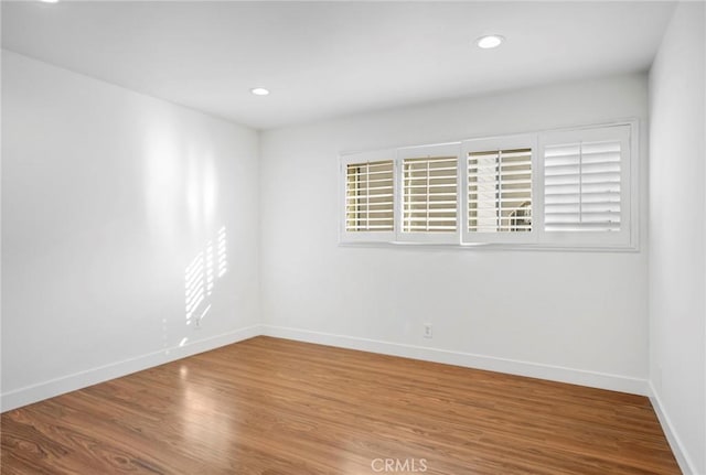 empty room featuring hardwood / wood-style flooring