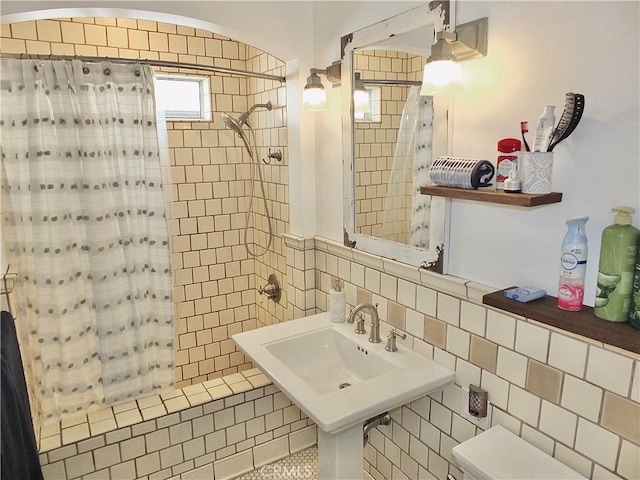 bathroom with tile patterned floors and a shower with curtain