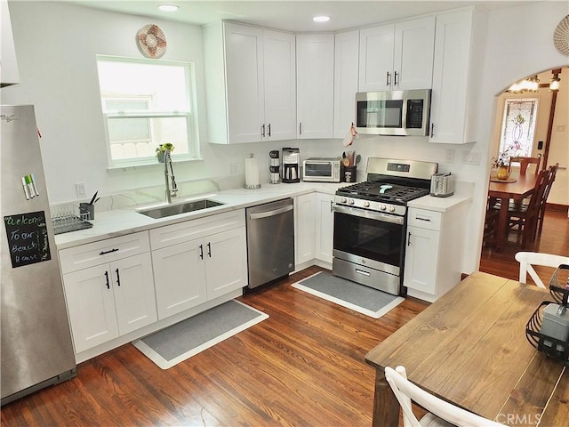 kitchen featuring white cabinets and appliances with stainless steel finishes