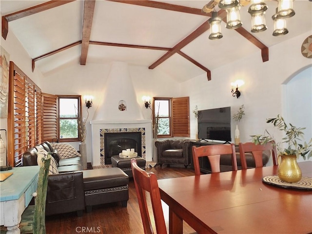 dining area with a fireplace, dark hardwood / wood-style floors, and a wealth of natural light