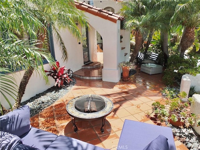 view of patio / terrace with a fire pit