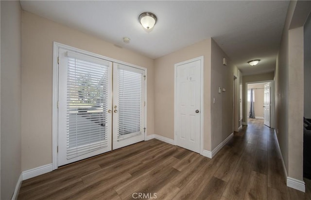 interior space featuring french doors and dark hardwood / wood-style flooring