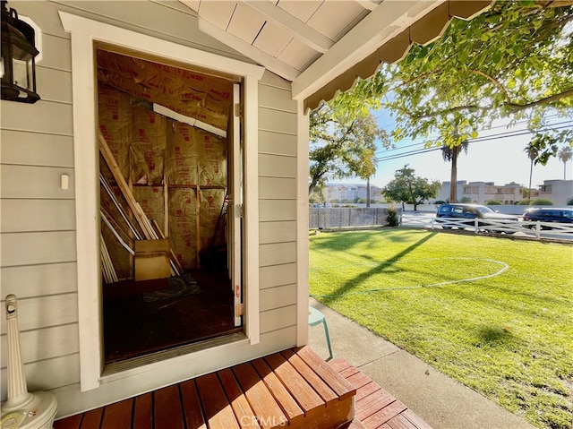 property entrance featuring a yard