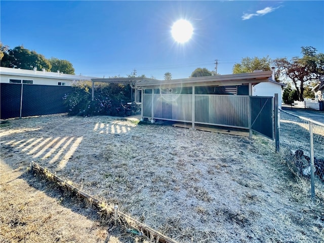 back of property featuring an outbuilding