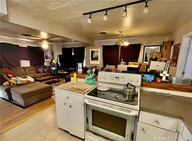 kitchen featuring ceiling fan, white cabinetry, rail lighting, white electric stove, and light wood-type flooring