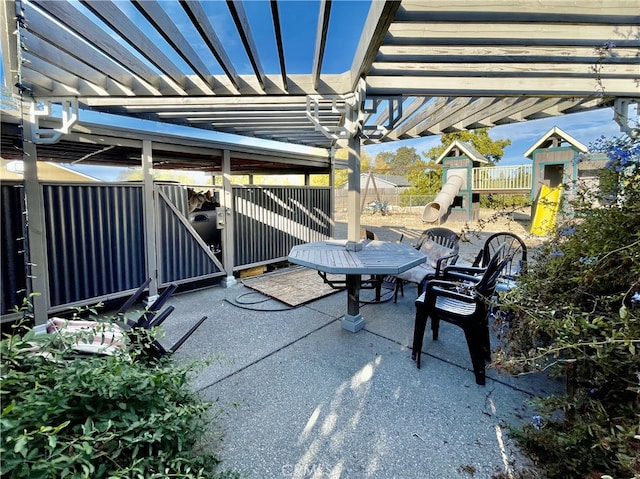 view of patio / terrace featuring a pergola and a playground