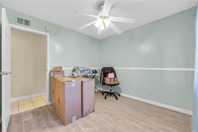 office space featuring ceiling fan and light wood-type flooring