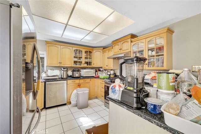 kitchen featuring appliances with stainless steel finishes, light brown cabinets, and light tile patterned floors