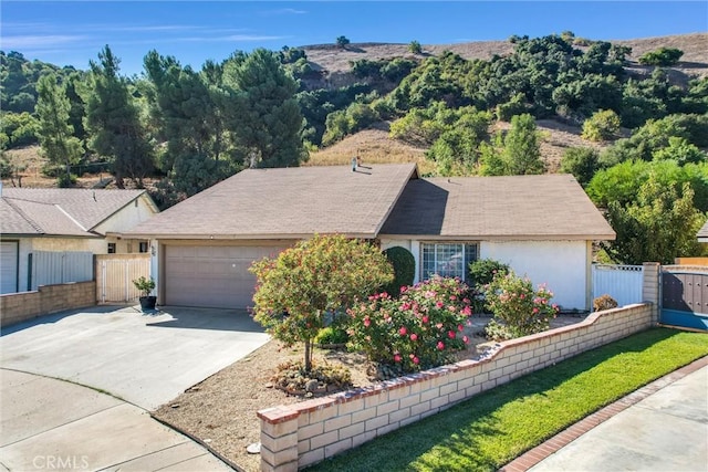 ranch-style house featuring a garage